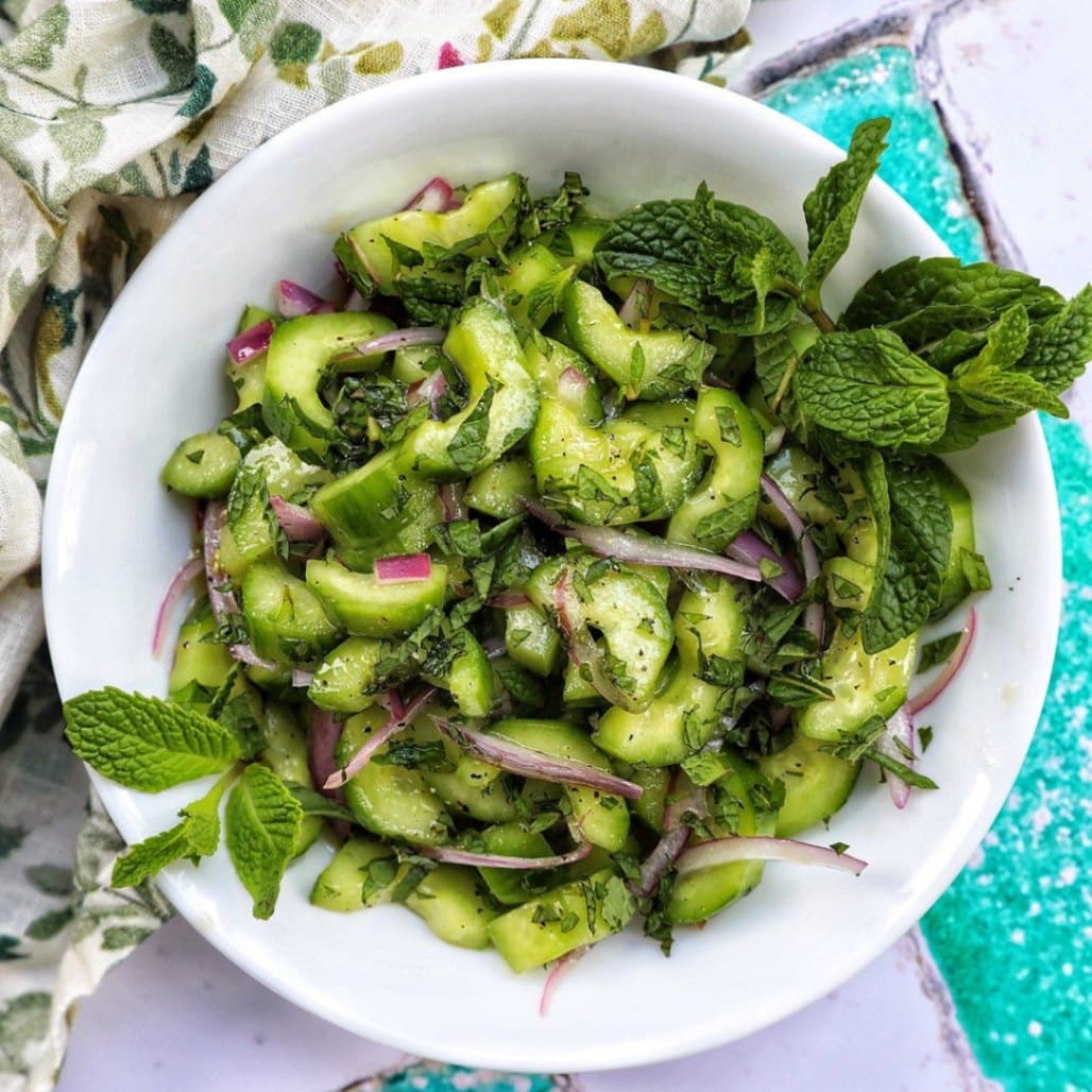 What Are Easy Summer Veggie Recipes for Light Meals? 7 Cucumber mint salad with sliced cucumber and fresh mint leaves