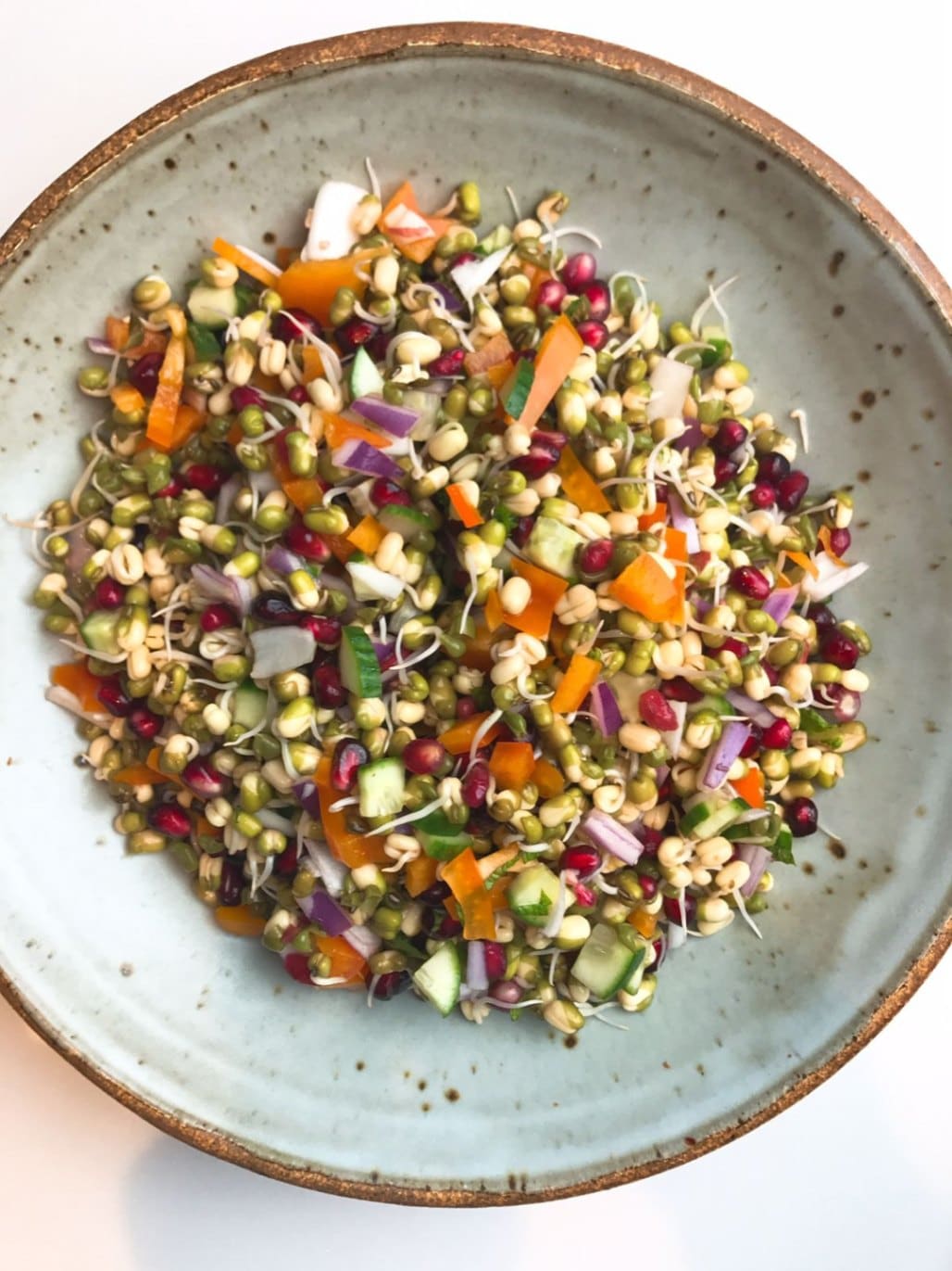 What Are Easy Summer Veggie Recipes for Light Meals? 9 Sprouts salad with mixed sprouts onion tomato and lemon dressing