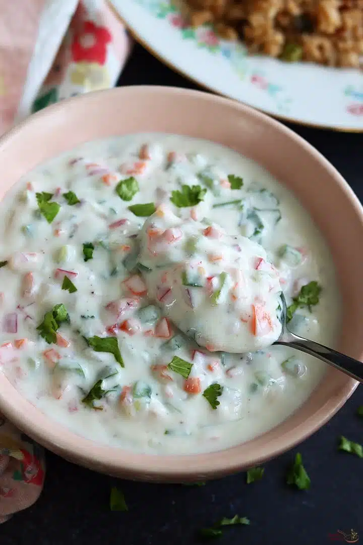 What Are Easy Summer Veggie Recipes for Light Meals? 10 Vegetable raita with yogurt cucumber and carrot in a bowl